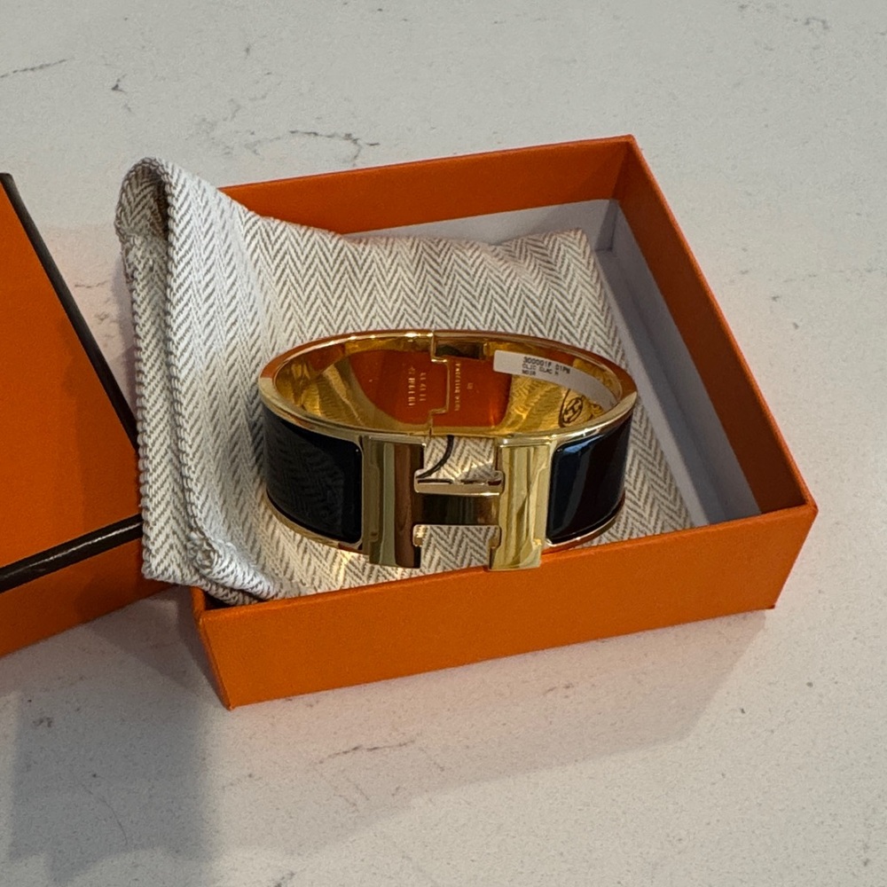 Gold and Black Hermes Clic Clac H Bracelet